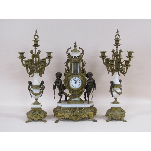 8 - A mid 20c Italian garniture de cheminée consisting of a clock and two six branch candelabra.  The fi... 