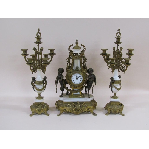 8 - A mid 20c Italian garniture de cheminée consisting of a clock and two six branch candelabra.  The fi... 