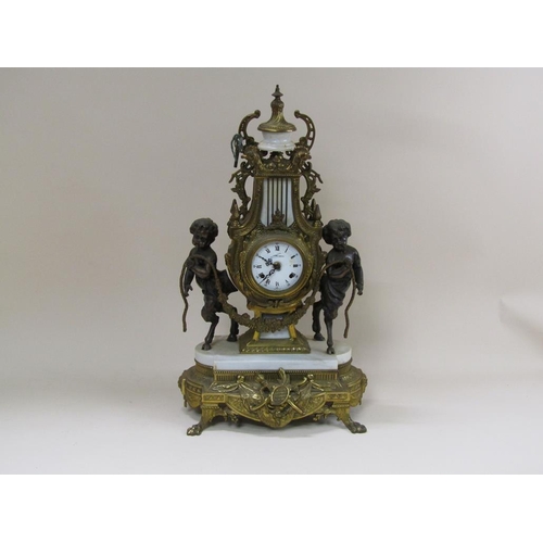 8 - A mid 20c Italian garniture de cheminée consisting of a clock and two six branch candelabra.  The fi... 