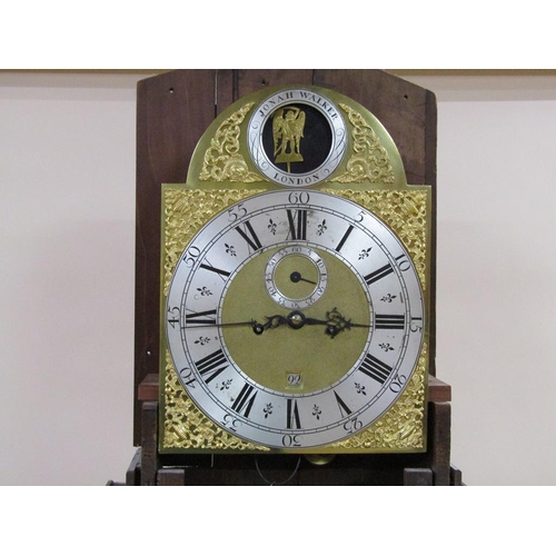 25 - A mid 18c eight day longcase clock by Jonah Walker of London, the 30cm brass arched dial having urn ... 