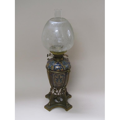 55 - A late 19c oil lamp with a Doulton Lambeth font within a brass frame, with burner and shade, 60cm h.