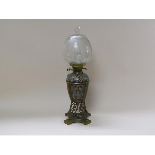 55 - A late 19c oil lamp with a Doulton Lambeth font within a brass frame, with burner and shade, 60cm h.