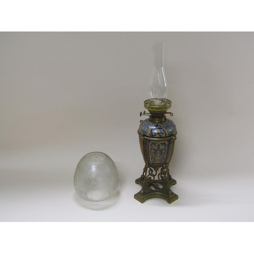 55 - A late 19c oil lamp with a Doulton Lambeth font within a brass frame, with burner and shade, 60cm h.