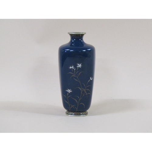 1334 - ORIENTAL WHITE METAL CLOISONNE VASE ON A BLUE GROUND WITH FLORAL DECORATION (A/F CHIP TO SHOULDER)