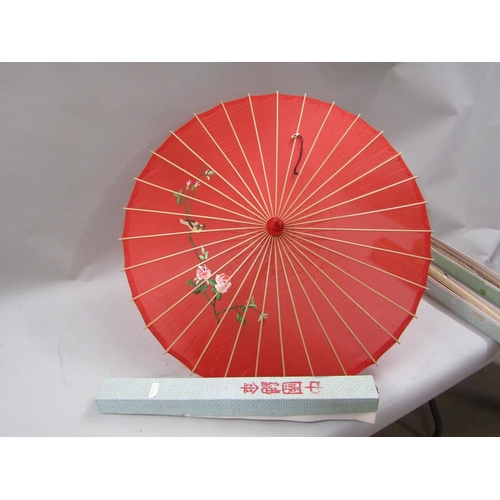 1166 - TWO ORIENTAL PARASOLS AND ONE LARGE FAN - 60cms H