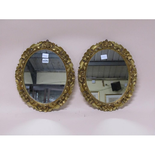 1171 - PAIR OF GILT WOOD AND STUCCO OVAL WALL MIRRORS, EACH 37CM X 31CM