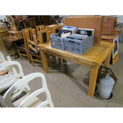 647 - OAK EXTENDING DINING TABLE AND SIX CHAIRS