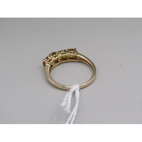 1443 - GOLD FOUR STONE SPHENE RING SIZE Q