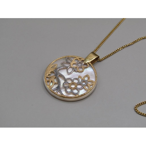 1407 - 18ct GOLD MOTHER OF PEARL PENDANT WITH A 9ct GOLD CHAIN