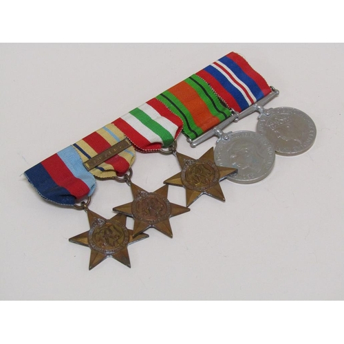 1386 - BAR OF SECOND WORLD WAR MEDALS AND MILITARY PHOTOGRAPHS