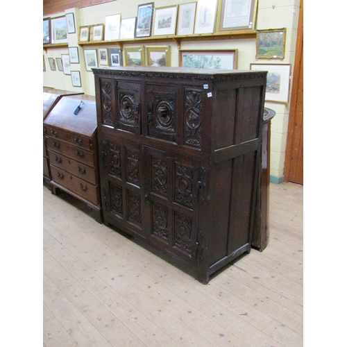 1736 - PERIOD OAK CUPBOARD WITH CARVED PANELS TO THE UPPER AND LOWER CUPBOARD - 110cms W x 140cms H