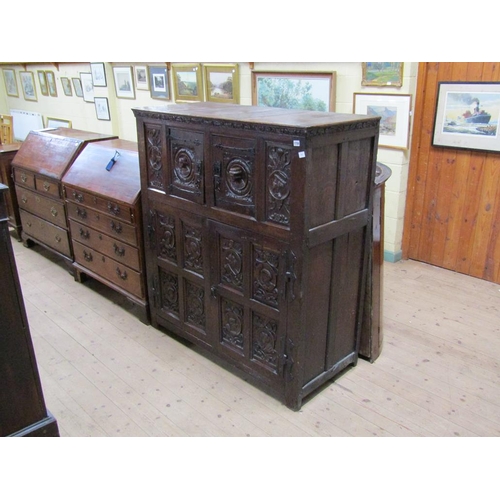 1736 - PERIOD OAK CUPBOARD WITH CARVED PANELS TO THE UPPER AND LOWER CUPBOARD - 110cms W x 140cms H