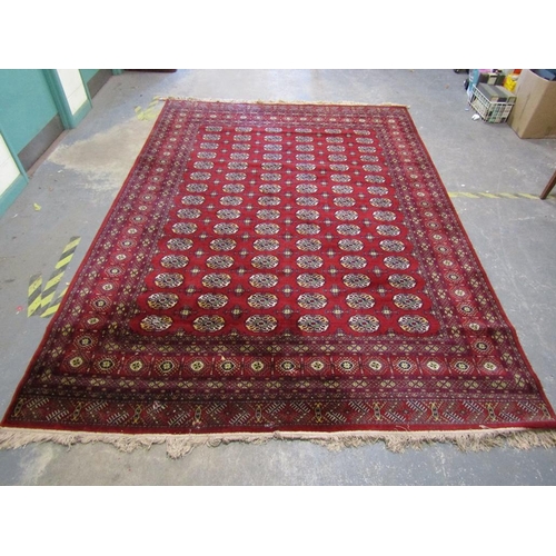 1739 - ORIENTAL RED GROUND WOOLLEN RUG 346 x 249cms