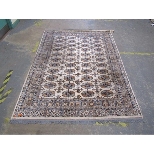 1740 - ORIENTAL FAWN GROUND PATTERNED RUG 235 x 172 cms