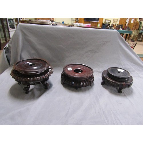 1207 - THREE CARVED WOOD ORIENTAL POT STANDS