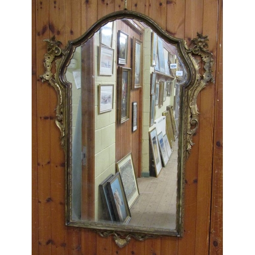 1231 - LATE 17C STYLE GILT WOOD AND STUCCO WALL MIRROR, 122CM X 92CM