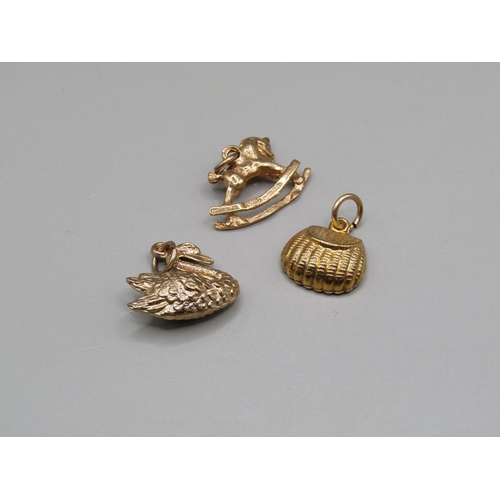 1608 - 9ct GOLD SWAN CHARM, 9ct ROCKING HORSE CHARM AND 9ct BAG CHARM