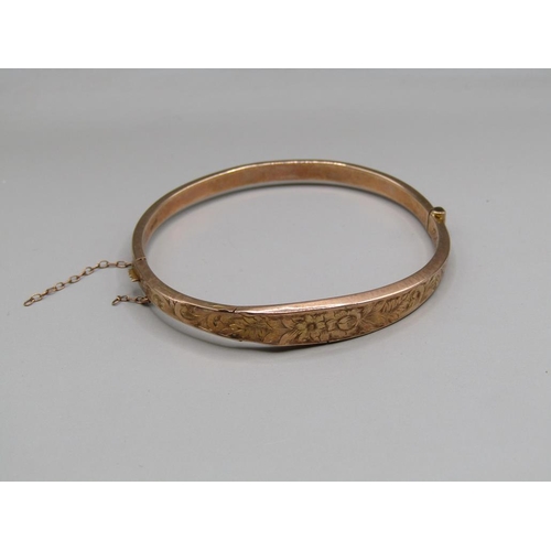 1651 - 9ct GOLD ENGRAVED BANGLE IN ORIGINAL FITTED BOX