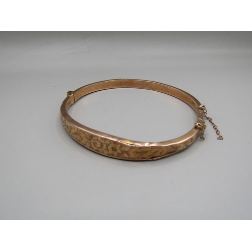 1651 - 9ct GOLD ENGRAVED BANGLE IN ORIGINAL FITTED BOX