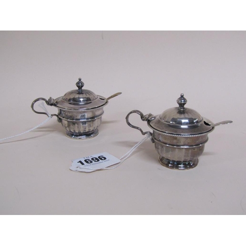 1696 - PAIR OF SILVER GLASS LINED MUSTARDS, ADIE BROS. BIRMINGHAM 1932 3.6ozt WITH MATCHING SILVER SPOONS