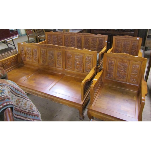 2045 - SUITE OF AFRICAN CARVED HARDWOOD COMPRISING TWO THREE SEATER SETTEES AND TWO ARMCHAIRS ALL WITH ANIM... 