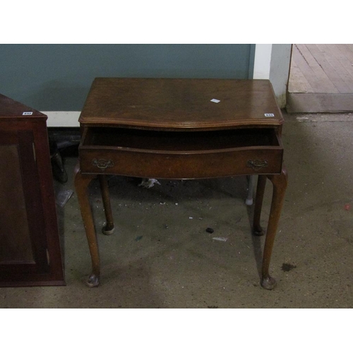 643 - SERPENTINE FRONTED WALNUT TABLE