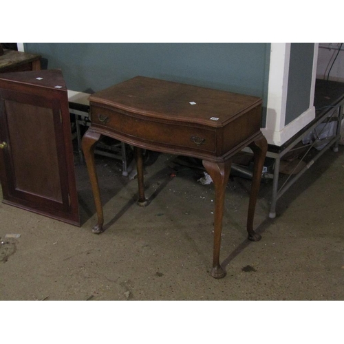 643 - SERPENTINE FRONTED WALNUT TABLE