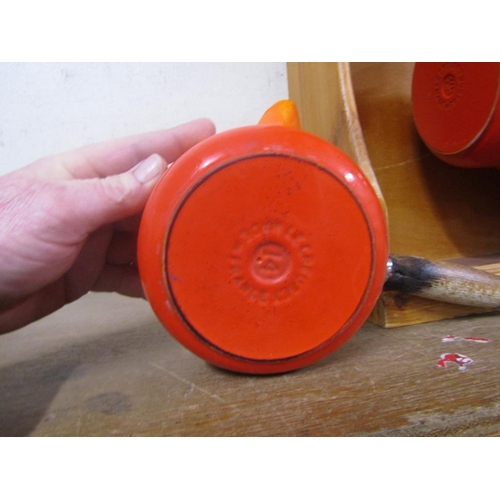 32 - SET OF LES CREUSET SAUCEPANS AND LIDS IN RACK