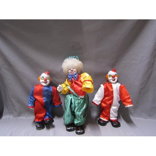 87 - PORCELAIN HEADED CLOWNS