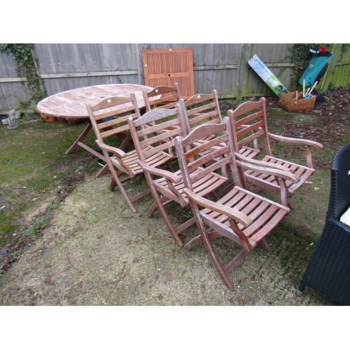 982 - WOODEN GARDEN TABLE AND SIX CHAIRS