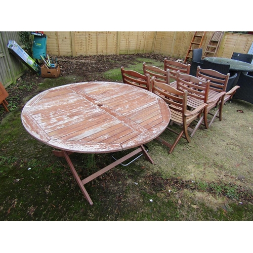 982 - WOODEN GARDEN TABLE AND SIX CHAIRS