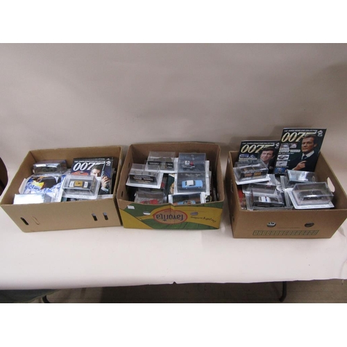 1313 - FIVE BOXED OF BOXED 007 MODEL DIECAST VEHICLES AND MAGAZINES