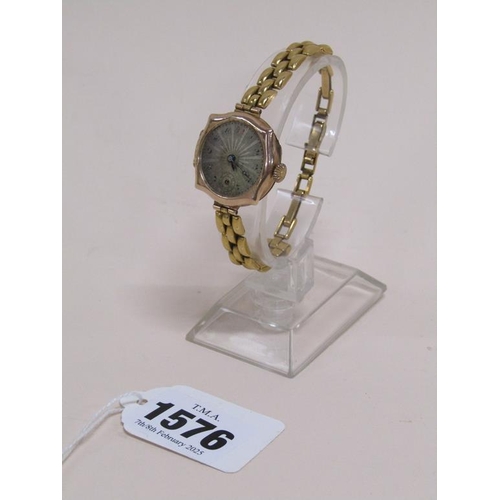 1576 - 9ct GOLD CASED WATCH ON GOLD PLATED STRAP