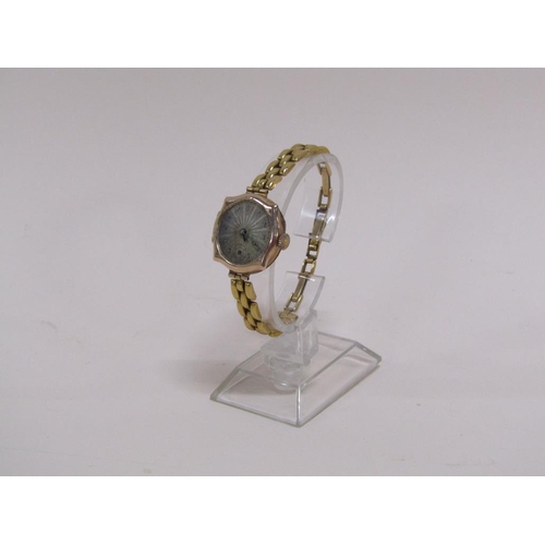 1576 - 9ct GOLD CASED WATCH ON GOLD PLATED STRAP