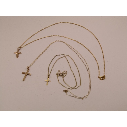 1590 - THREE 9ct GOLD NECKLACES WITH CRUCIFIX PENDANTS