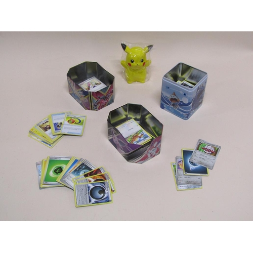 1645 - THREE TINS OF POKEMON CARDS AND PIKACHU