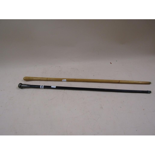 1400 - TWO WALKING CANES - ONE EBONISED WITH SILVER KNOP