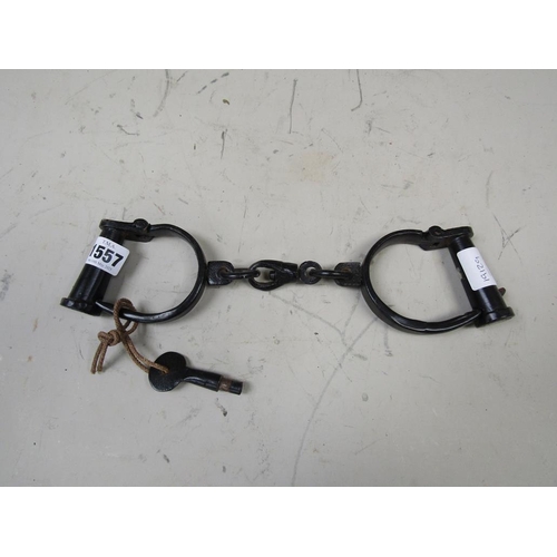 1557 - PAIR OF IRON HAND CUFFS