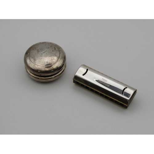 1615 - ASPREY SILVER HARMONICA AND A SILVER ASPREY CASED YOYO