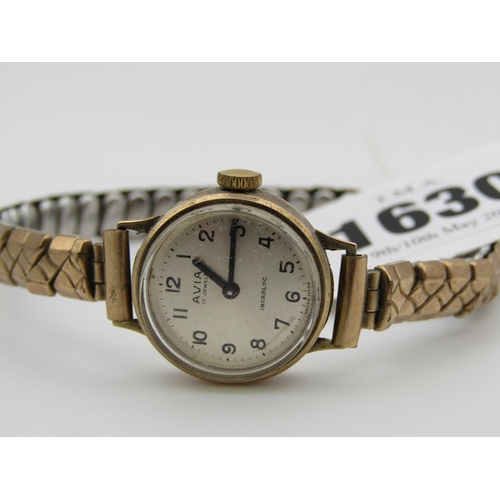 1630 - 9ct GOLD CASED AVIA LADIES WATCH ON EXPANDING PLATED STRAP