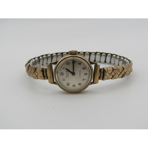 1630 - 9ct GOLD CASED AVIA LADIES WATCH ON EXPANDING PLATED STRAP