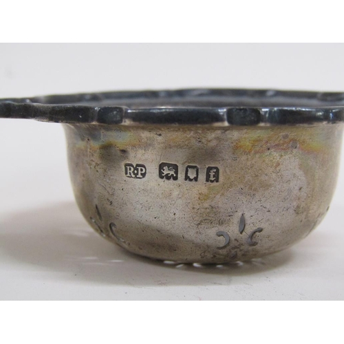 1652 - SILVER TEA STRAINER AND A SILVER CASED PEPPER
