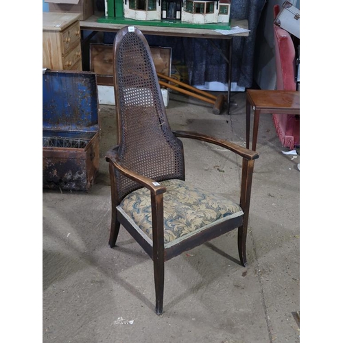 670 - CANE BACKED ARMCHAIR