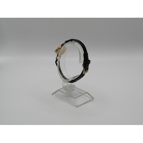 1446 - 9ct GOLD CASED LADIES LONGINES WATCH ON A BLACK LEATHER STRAP