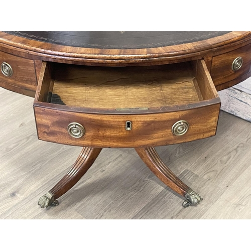 1061 - Antique Regency revival drum table, fitted with four drawers and four dummy drawers, brass pulls, to... 