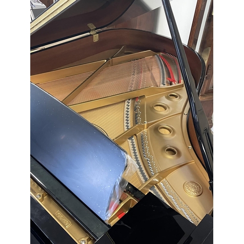 1076 - Pristine Kawai Grand Piano. Ebonized cabinet work along with a matching adjustable stool, dated 04/2... 