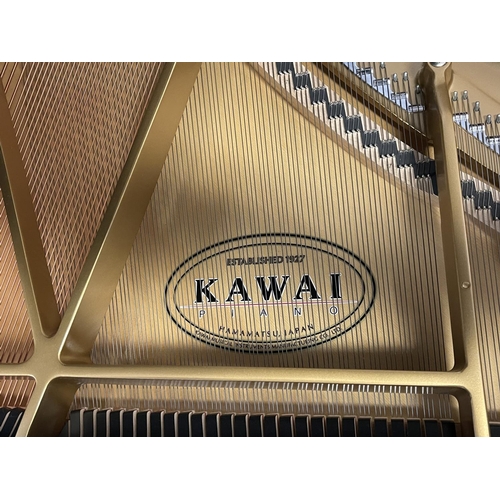 1076 - Pristine Kawai Grand Piano. Ebonized cabinet work along with a matching adjustable stool, dated 04/2... 