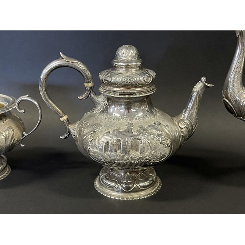 1163 - Antique sterling silver four piece tea & coffee service, each of baluster shape, and repousse worked... 