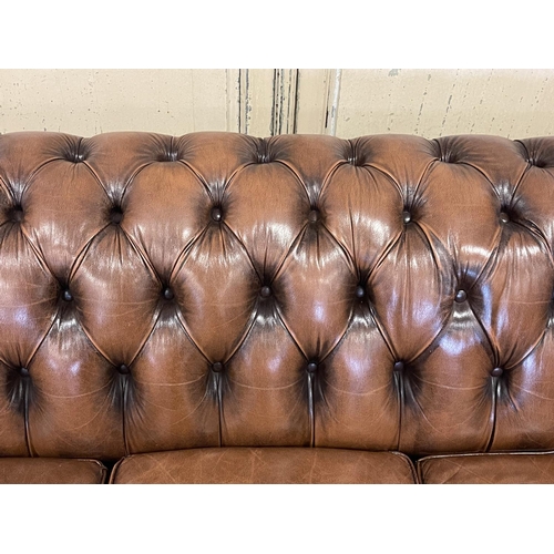 1100 - Moran brown leather deep buttoned three seater Chesterfield, approx 67cm H x 193cm W x 91cm D