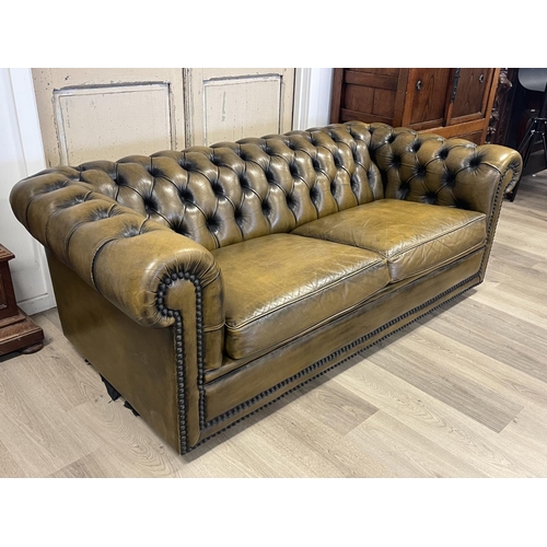 1101 - Moran parti leather deep buttoned three seater Chesterfield, approx 68cm H x 188cm W x 90cm D